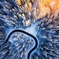 Road serpentine in wintertime from above. Asphalt road serpentine in snowy wintertime. Cold Royalty Free Stock Photo