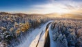Road serpentine in wintertime from above. Asphalt road serpentine in snowy wintertime. Cold Royalty Free Stock Photo