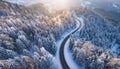 Road serpentine in wintertime from above. Asphalt road serpentine in snowy wintertime. Cold Royalty Free Stock Photo