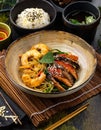 Various dishes of Asian cuisine with different types noodles and rice with shrimp, duck, vegetables and black sesame Royalty Free Stock Photo