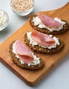 Crispy rye bread with sesame seeds, ham and cottage cheese. Royalty Free Stock Photo