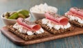 Crispy rye bread with sesame seeds, ham and cottage cheese. Royalty Free Stock Photo