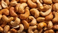 Roasted, salted cashew nuts close up. Full frame top view of huge amount of roasted, salted cashew nuts Royalty Free Stock Photo