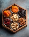 Mixed dried fruits and nuts. Assorted dried fruits and nuts in wooden box Royalty Free Stock Photo