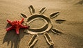 A sun with rays is drawn on the sand, and a sea red star was placed. Sun, rays, travel, starfish. Royalty Free Stock Photo