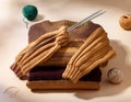 Knitted sweaters with knitting needles and wool in basket Royalty Free Stock Photo