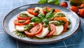 Italian cuisine: caprese salad and breadsticks with ham. Party dish Royalty Free Stock Photo