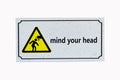 Sign warning mind your head isolated on white background. Royalty Free Stock Photo