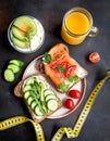 Fitness breskfast with homemade sandwiches on dark table background top view Royalty Free Stock Photo