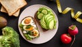Fitness breskfast with homemade sandwiches on dark table background top view Royalty Free Stock Photo