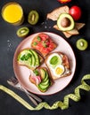 Fitness breskfast with homemade sandwiches on dark table background top view Royalty Free Stock Photo