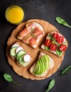 Fitness breskfast with homemade sandwiches on dark table background top view Royalty Free Stock Photo