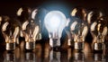 Great business idea. 3D Rendering. Bright bulb lit between unlit bulbs. Successful and intelligent idea Royalty Free Stock Photo