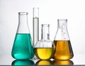 Laboratory bottles - test tubes and beakers - on white Royalty Free Stock Photo