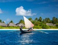 A traditional outrigger canoe sailing in Ailinglaplap Atoll, Royalty Free Stock Photo