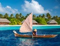 A traditional outrigger canoe sailing in Ailinglaplap Atoll, Royalty Free Stock Photo