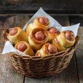 Pigs in a planket. Puff pastry rolls with sausages on a wooden background. Fast food or beer Royalty Free Stock Photo