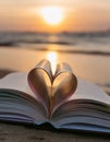 Heart shape paper book on the beach. Heart from a book page on the beach against a beautiful Royalty Free Stock Photo