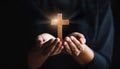 Person palm hands to hold holy cross, crucifix to worship. Royalty Free Stock Photo