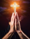 Person palm hands to hold holy cross, crucifix to worship. Royalty Free Stock Photo