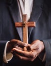 Person palm hands to hold holy cross, crucifix to worship. Royalty Free Stock Photo