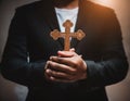 Person palm hands to hold holy cross, crucifix to worship. Royalty Free Stock Photo