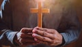 Person palm hands to hold holy cross, crucifix to worship. Royalty Free Stock Photo
