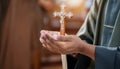 Person palm hands to hold holy cross, crucifix to worship. Royalty Free Stock Photo