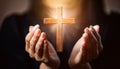 Person palm hands to hold holy cross, crucifix to worship. Royalty Free Stock Photo