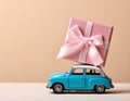 Car with staple gift on neutral background Royalty Free Stock Photo