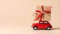 Car with staple gift on neutral background Royalty Free Stock Photo