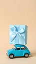 Car with staple gift on neutral background Royalty Free Stock Photo