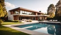 New modern house with backyard swimming pool on sunny day Royalty Free Stock Photo