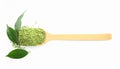 Scoop with powdered matcha tea and green leaves on white background Royalty Free Stock Photo