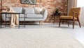 Beige carpet in modern living room interior with industrial furniture and brick wall Royalty Free Stock Photo