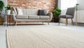 Beige carpet in modern living room interior with industrial furniture and brick wall Royalty Free Stock Photo