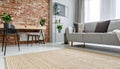 Beige carpet in modern living room interior with industrial furniture and brick wall Royalty Free Stock Photo