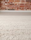 Beige carpet in modern living room interior with industrial furniture and brick wall Royalty Free Stock Photo