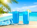 Blue Summer Juice. A summer concept with waves, palms and sunshine Royalty Free Stock Photo