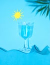 Blue Summer Juice. A summer concept with waves, palms and sunshine Royalty Free Stock Photo