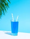 Blue Summer Juice. A summer concept with waves, palms and sunshine Royalty Free Stock Photo