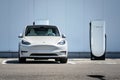 Tesla Model Y electric car at a charging station. Royalty Free Stock Photo