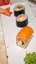 Closeup of platter with sushi menu assorted on the table restaurant - sushi rolls on plate Royalty Free Stock Photo