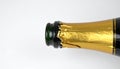 Champagne bottle. Neck of a bottle of Champagne on white background Royalty Free Stock Photo