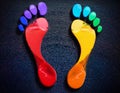Colorful foot prints in paint Royalty Free Stock Photo
