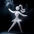 A stylized silhouette of a female figure is crafted from wispy white smoke Royalty Free Stock Photo
