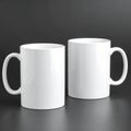 Two blank white mugs on black background. Mockup for design Royalty Free Stock Photo
