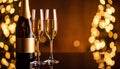 Brown background with blurry light on glasses of champagne and bottle on mirror surfa Royalty Free Stock Photo
