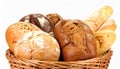Different loaves of fresh bread in basket isolated on white Royalty Free Stock Photo