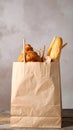 Paper bag with pastry and takeaway food on wooden table Royalty Free Stock Photo